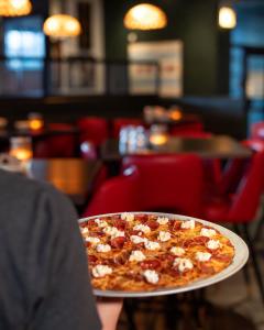 Home Run Inn crowns Chicago’s tavern-style pizza with its own national holiday on Oct. 22